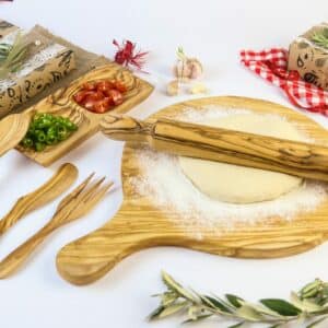 Wood Cooking Utensils: wood pizza board, appetizer wood serving dish with 2 compartments and an olive wood rolling pin.