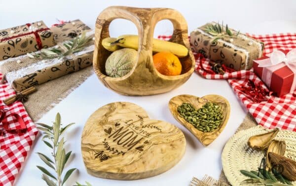 Wooden Serving Utensils; a wooden fruit basket with handle, a heart-shaped Cutting board and a heart-shaped serving dish