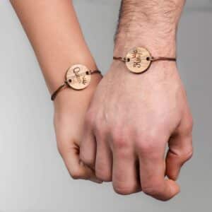 2 His and Hers Matching Bracelets Wooden. Fine leather strap and round engraved pendant.