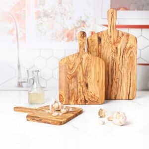Set of 3 Olive Wood Cutting Boards with Handles. Each cutting board is different in size.