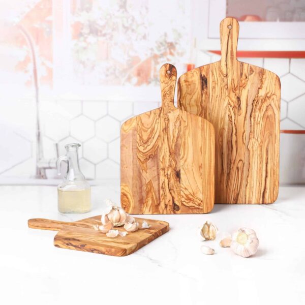 Set of 3 Olive Wood Cutting Boards with Handles. Each cutting board is different in size.