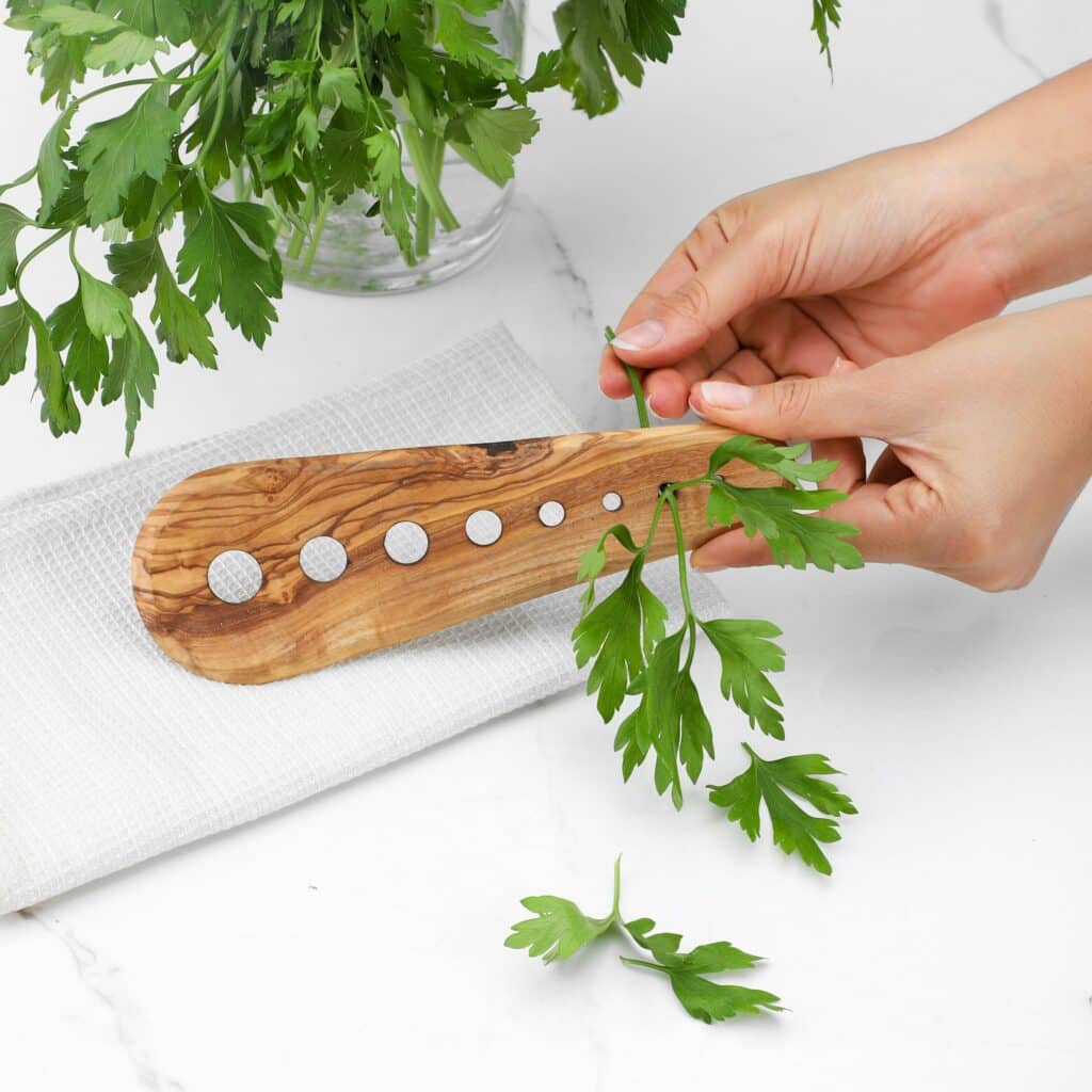 Wood herb stripper with 7 holes.