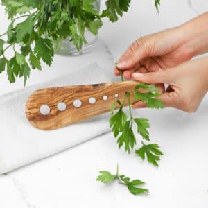 Wooden herb stripper with 8 holes.